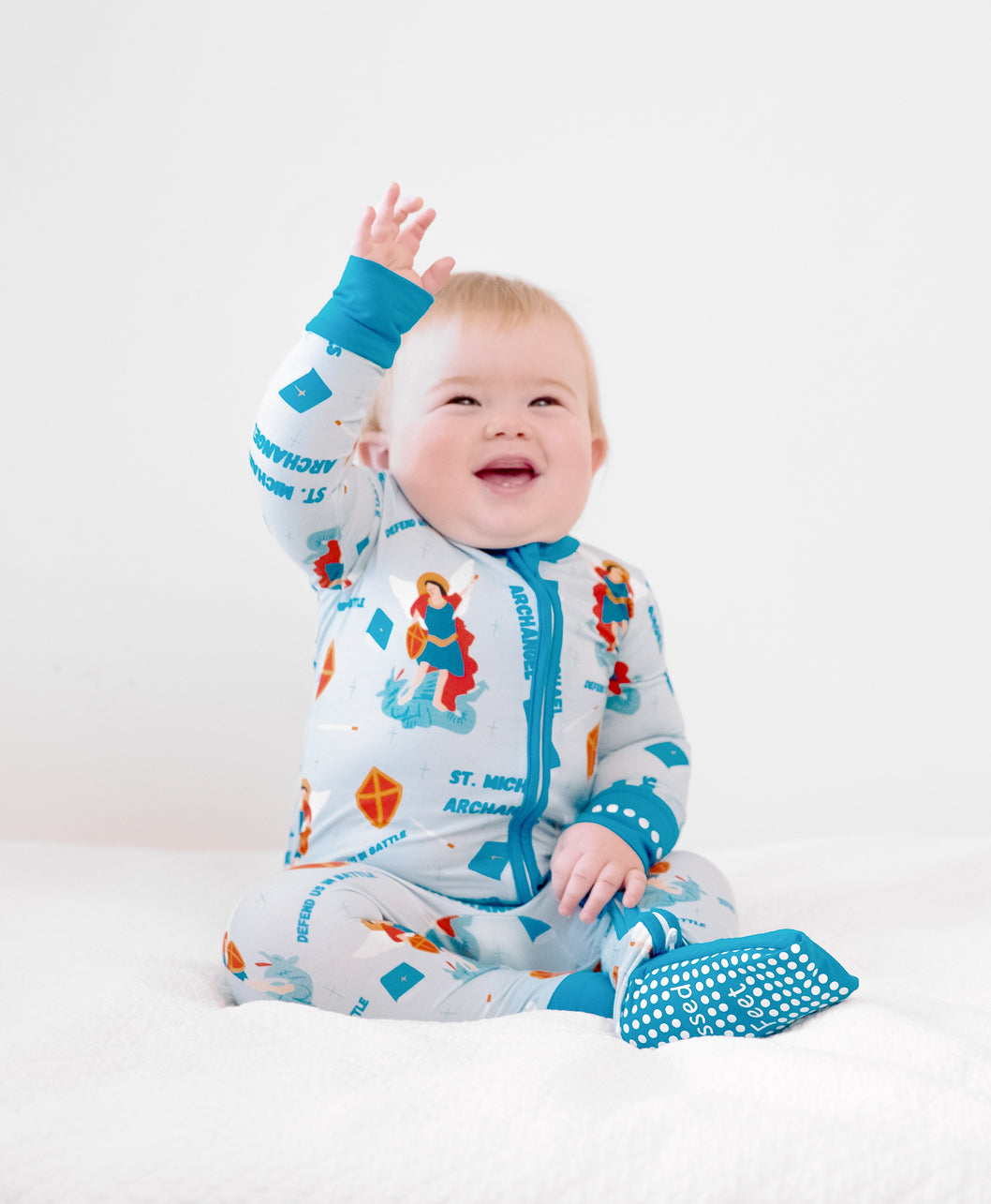 Baby boy wearing St Michael the Archangel Catholic Saint baby boy footie pajamas