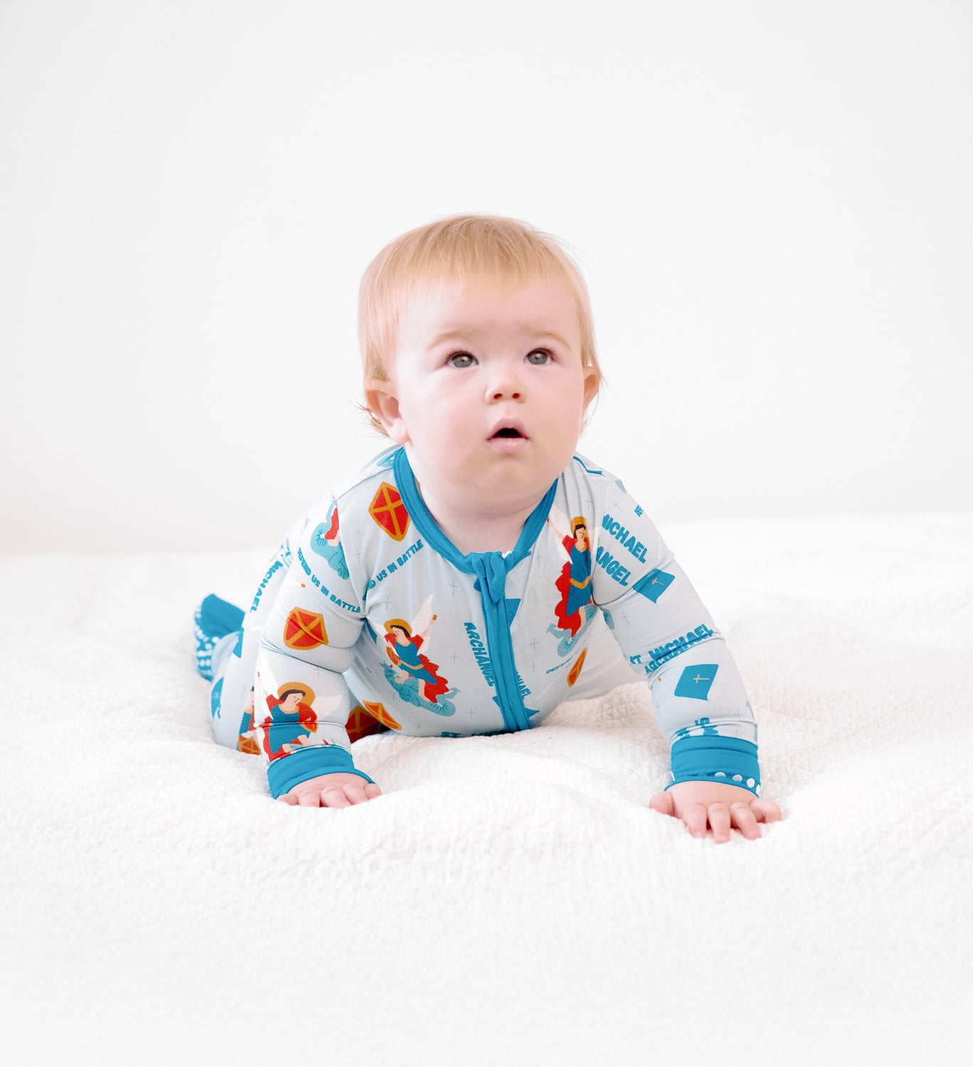 Baby boy wearing St Michael the Archangel Catholic Saint baby boy footie pajamas