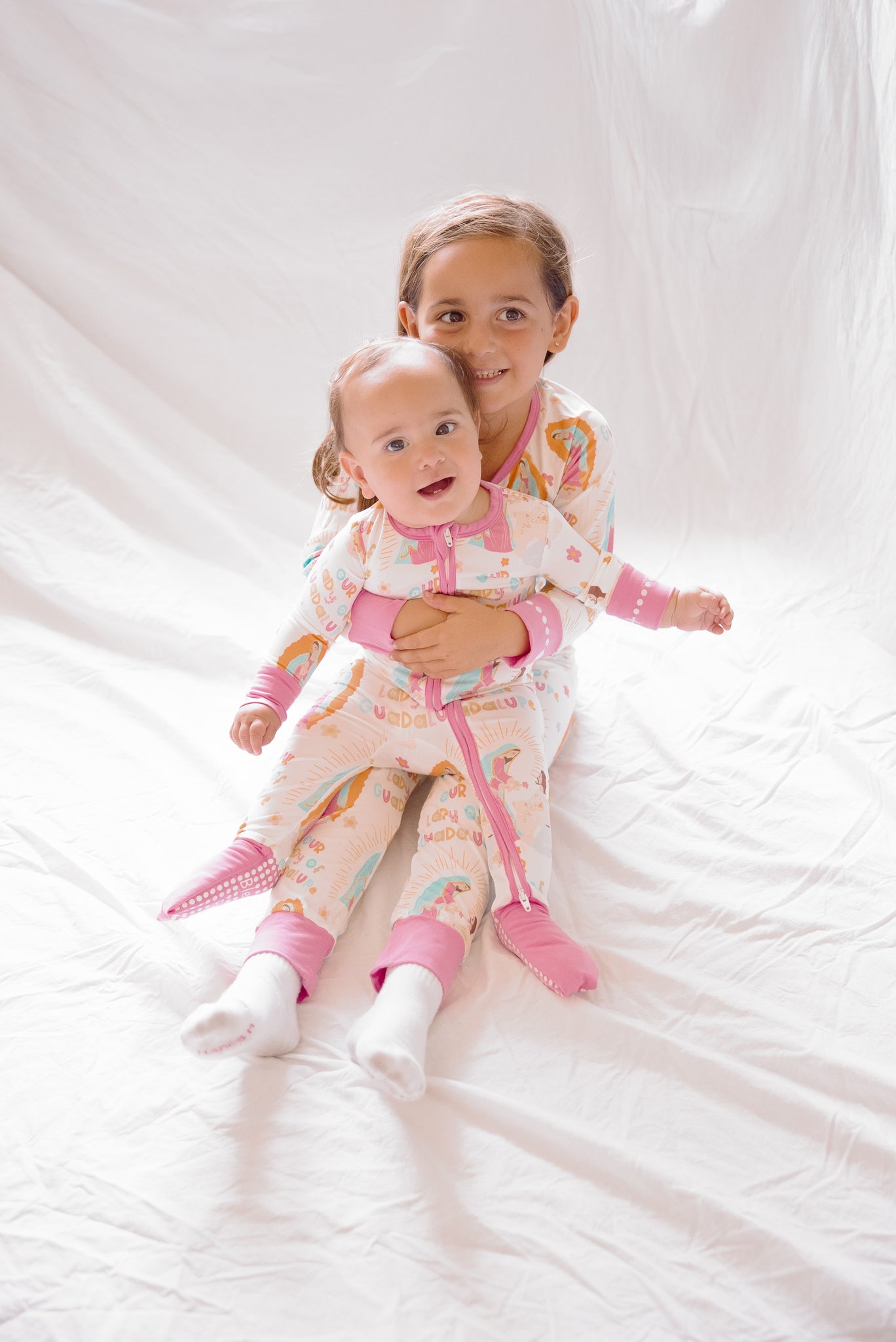 Girls wearing matching Our Lady of Guadalupe pajamas