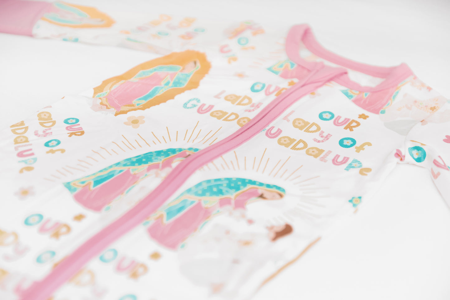 Closeup of Our Lady of Guadalupe Catholic baby girl footie pajamas