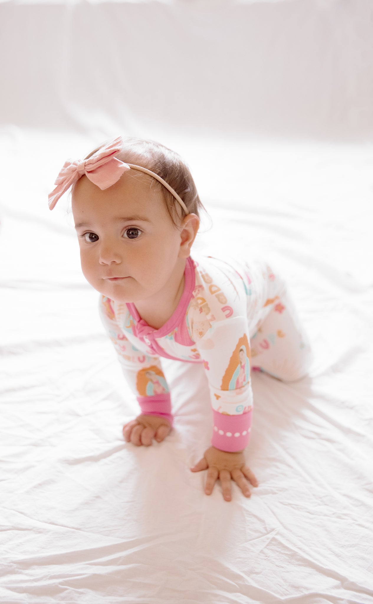 Baby girl wearing Our Lady of Guadalupe pajamas
