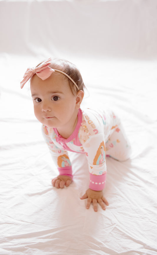 Baby girl wearing Our Lady of Guadalupe pajamas