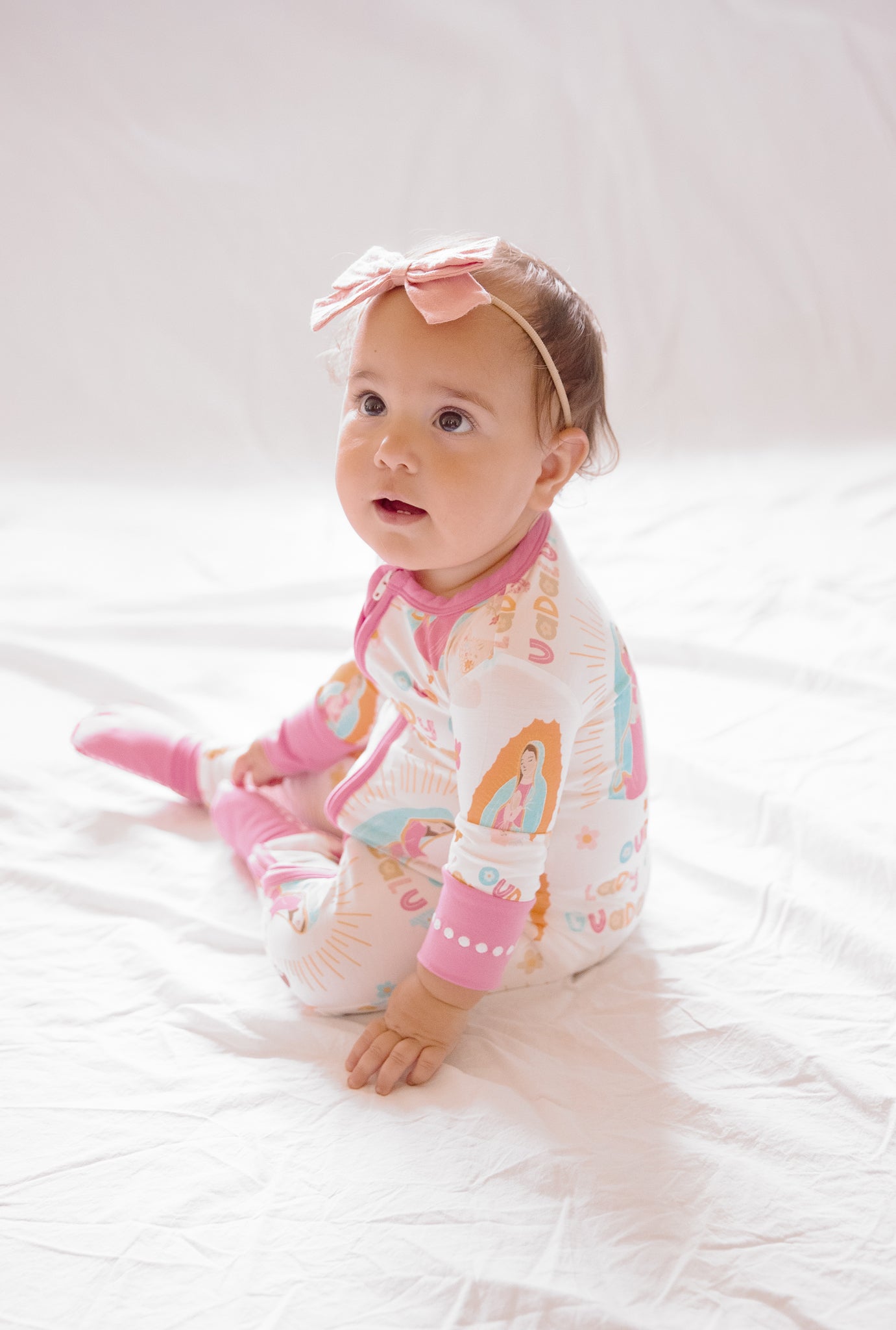 Baby girl wearing Our Lady of Guadalupe pajamas
