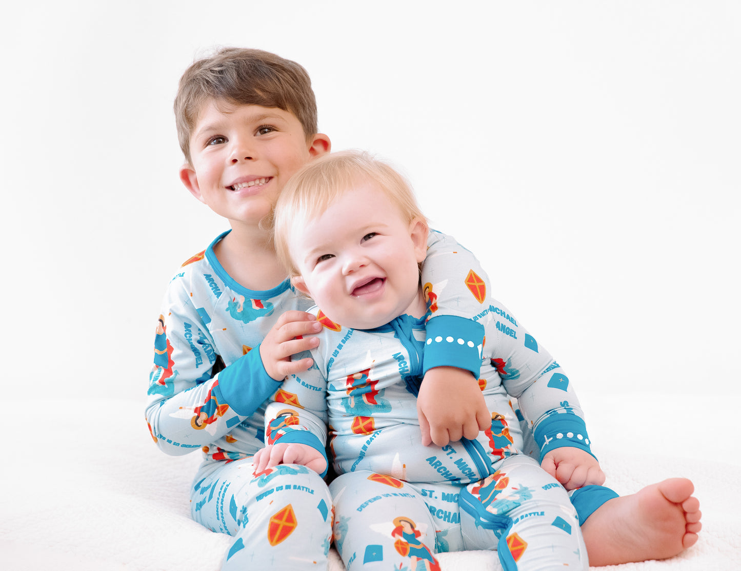 Boys wearing matching Catholic Saint Michael the Archangel pajamas