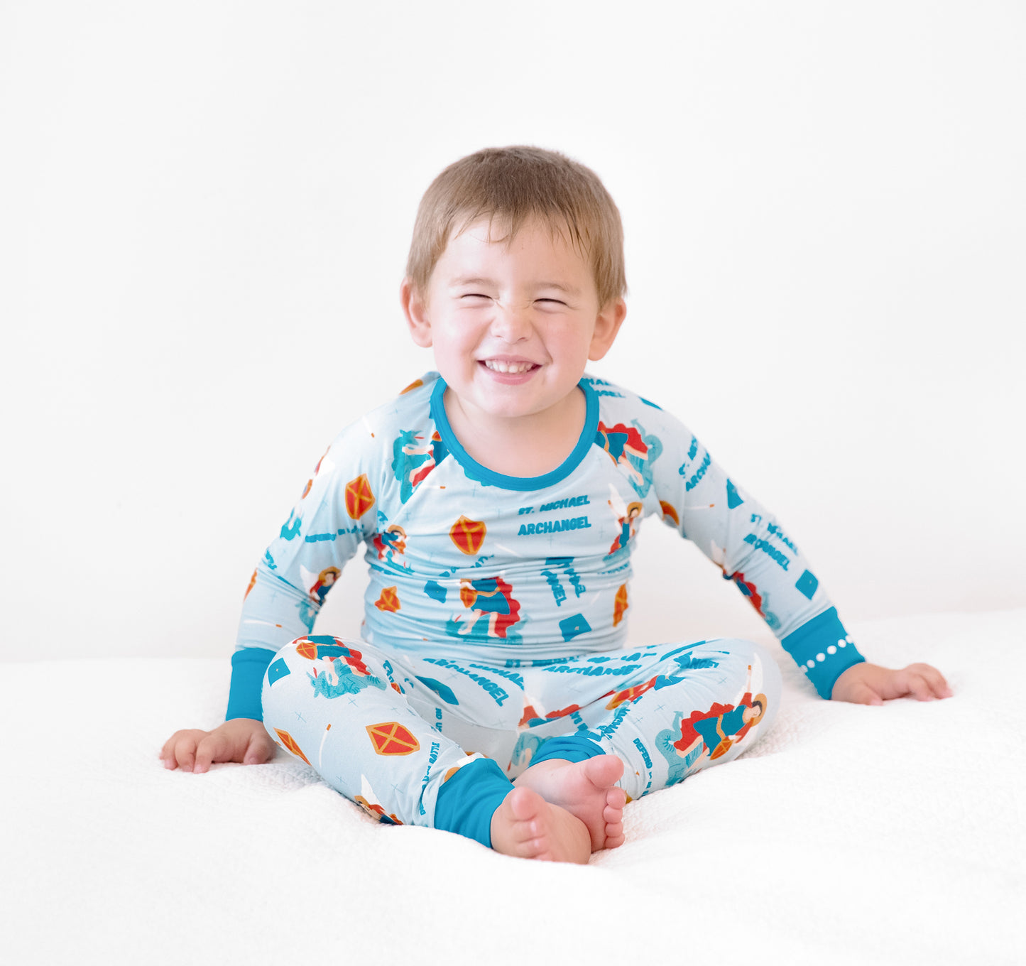 Boy wearing St Michael the Archangel Catholic Saints two-piece pajamas