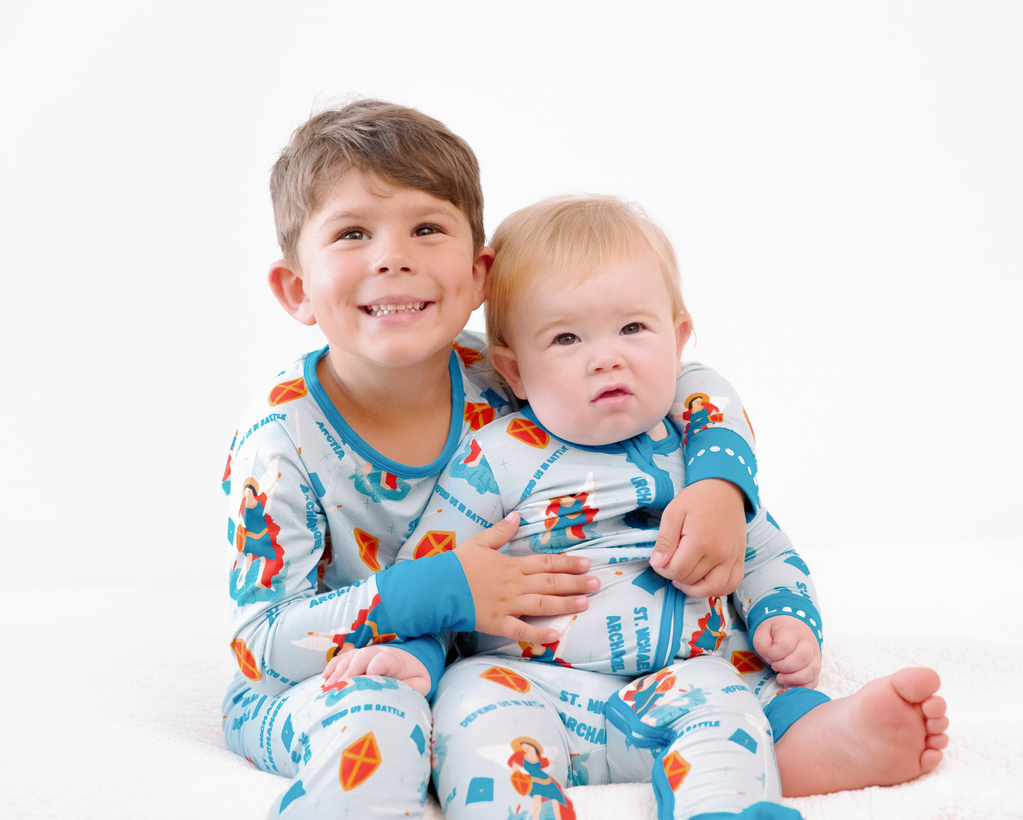 Boys wearing matching Catholic Saint Michael the Archangel pajamas