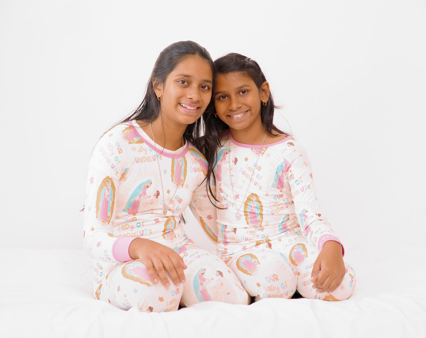Girls wearing matching Our Lady of Guadalupe Catholic pajamas