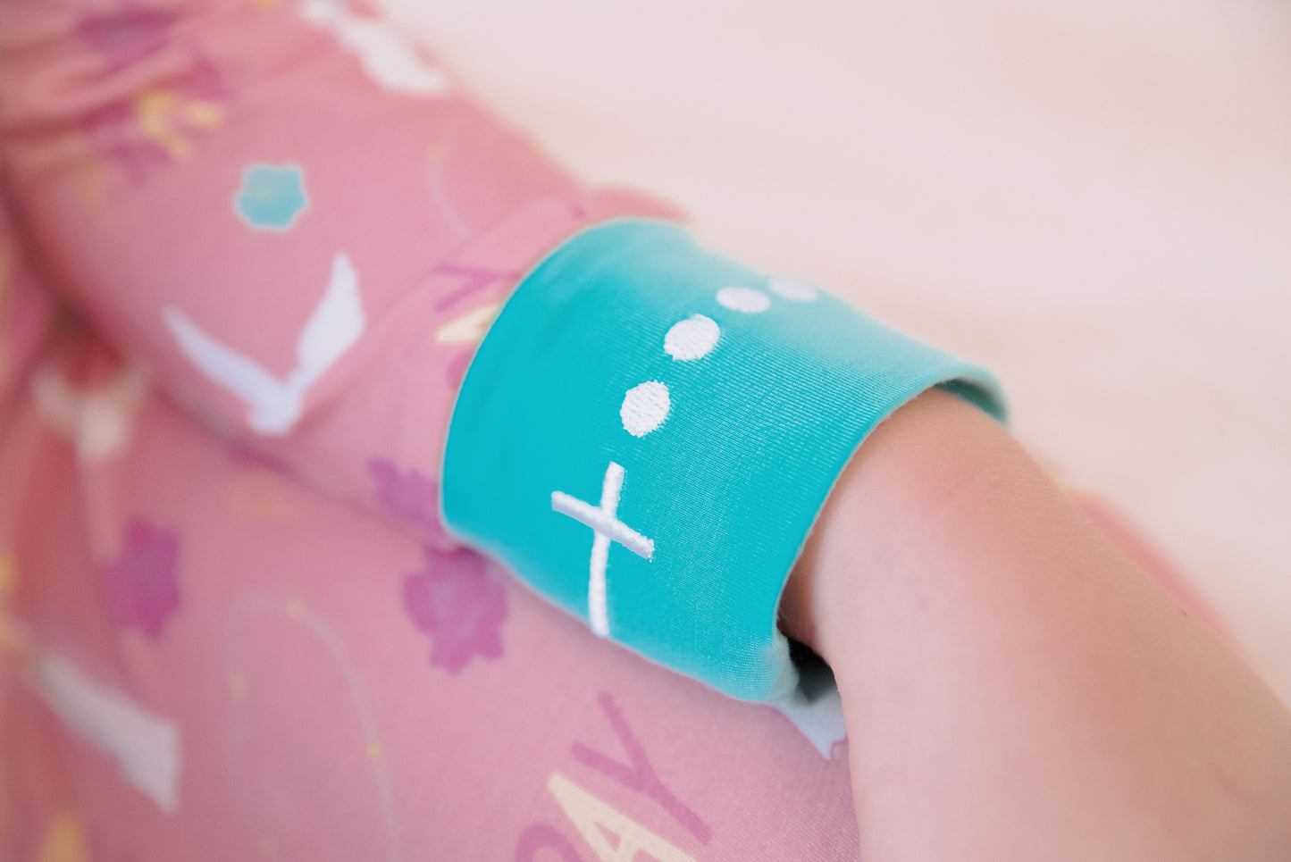 Embroidered rosary wrist detail on Girls Catholic Pray Pajamas