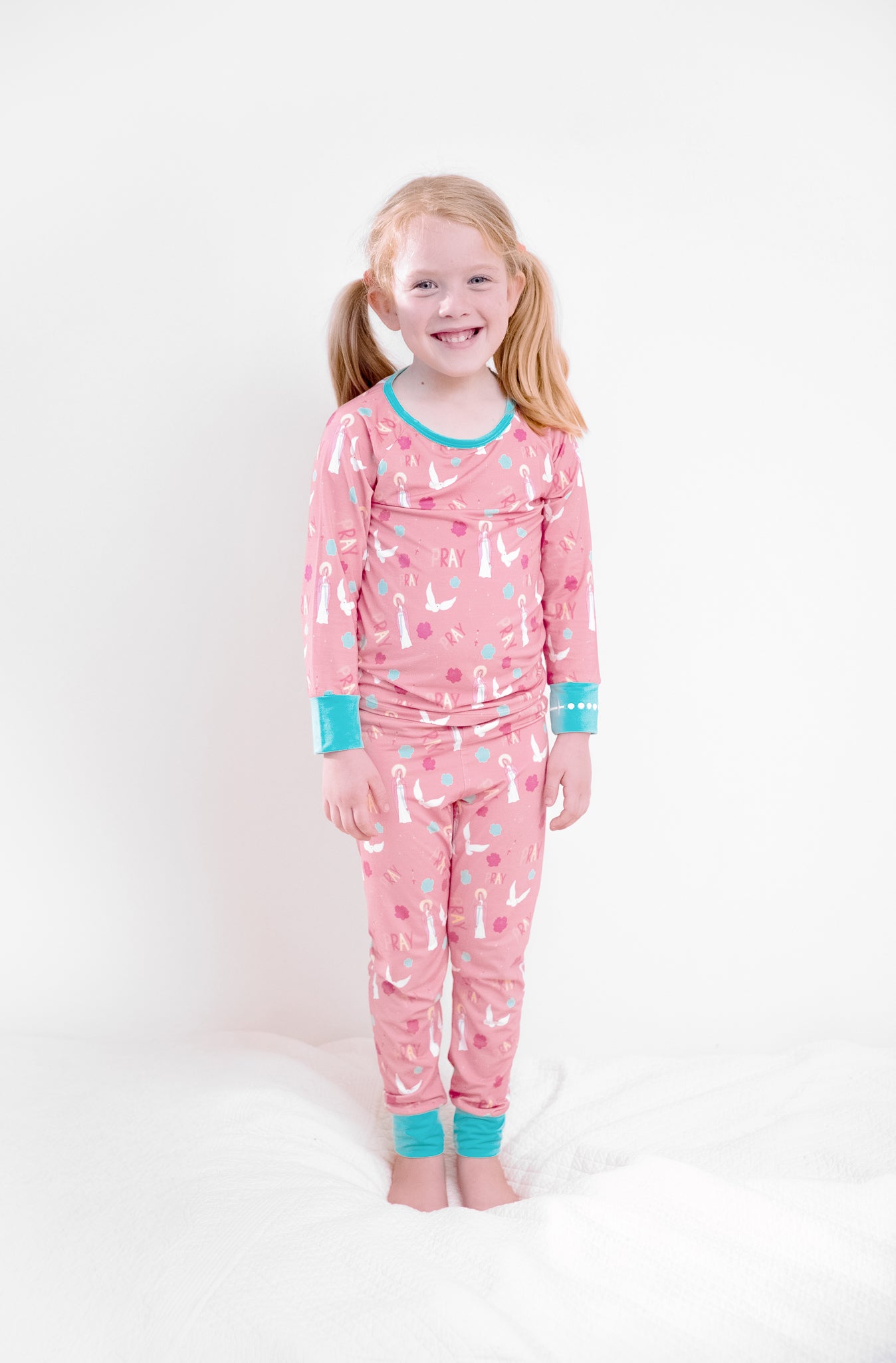 Girl wearing Catholic Pray Pajamas