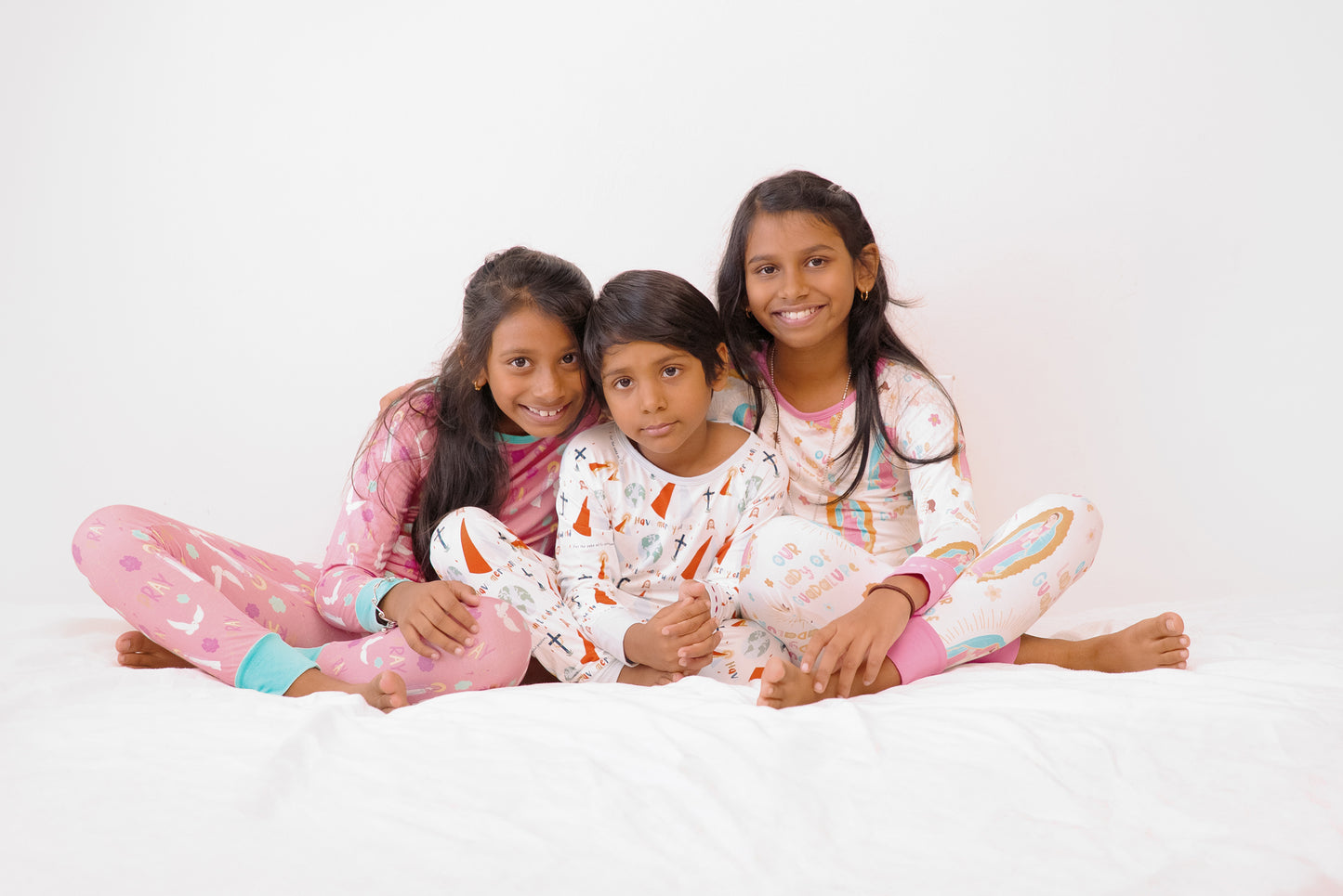 Kids wearing Catholic pajamas