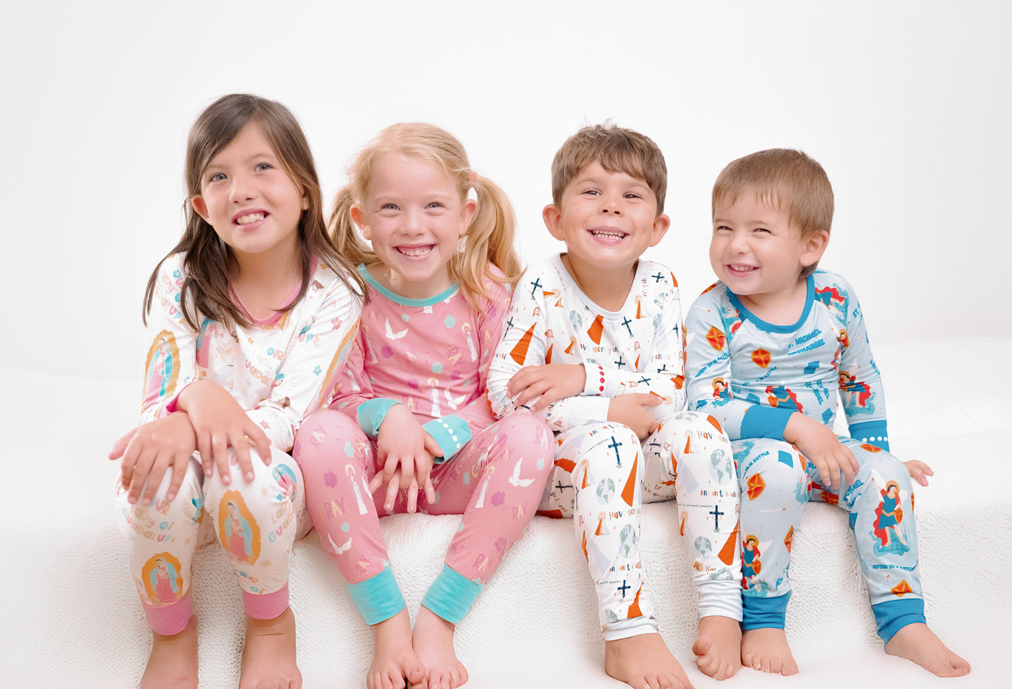 Kids wearing Catholic pajamas
