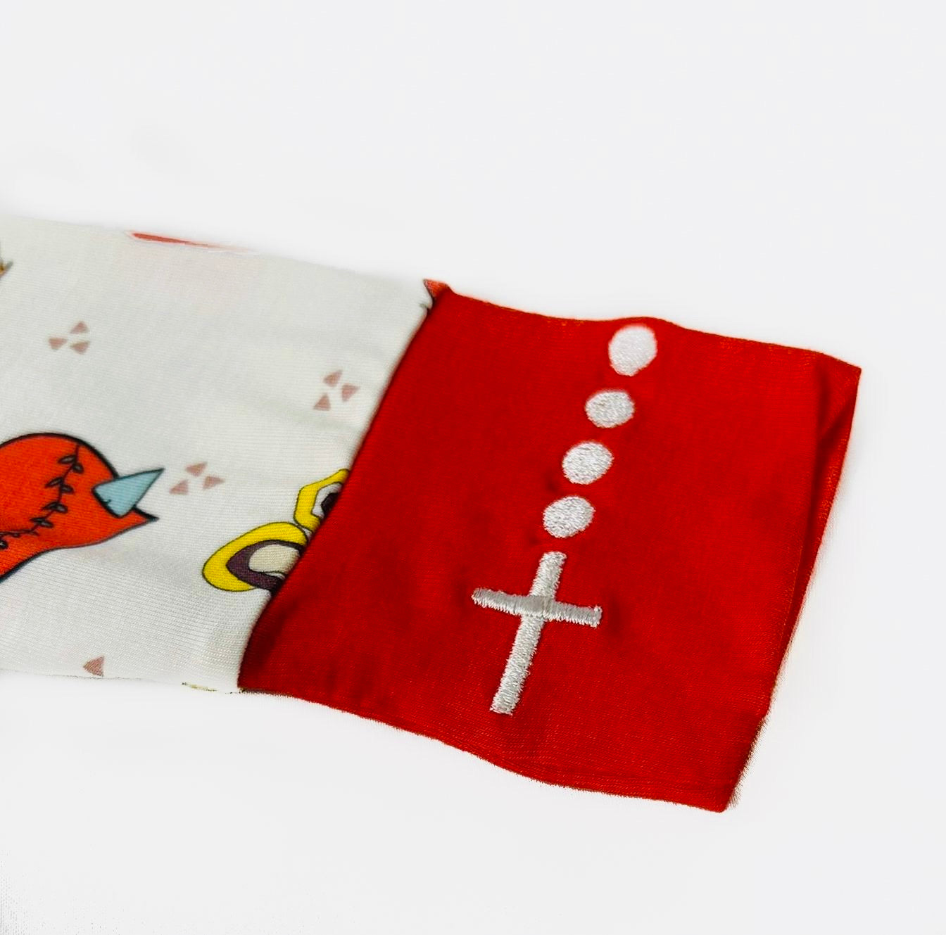 Embroidered rosary wrist detail on Catholic kids pajamas