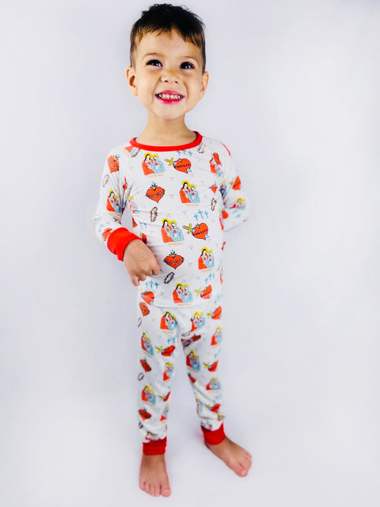 Boy wearing Sacred Heart of Jesus and Immaculate Heart of Mary pajamas