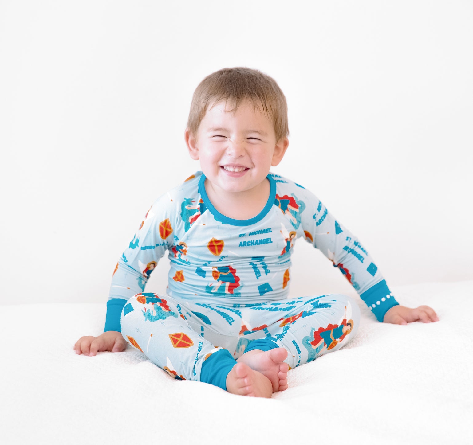 Boy wearing St Michael the Archangel Catholic Saints two-piece pajamas
