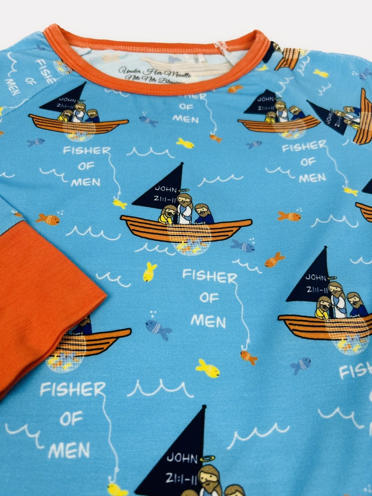 Children's pajama set with 'Fisher of Men' bible story design on a blue background