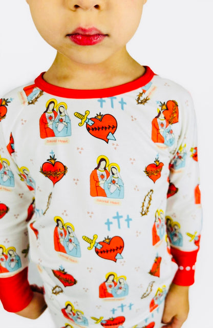 Boy wearing Sacred Heart of Jesus and Immaculate Heart of Mary pajamas 