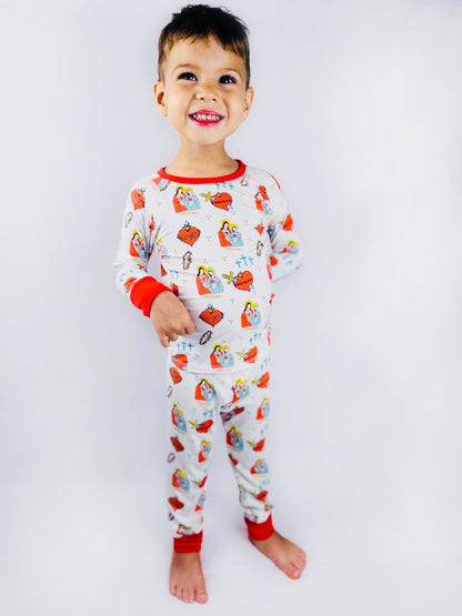 Boy wearing Sacred Heart of Jesus and Immaculate Heart of Mary pajamas 