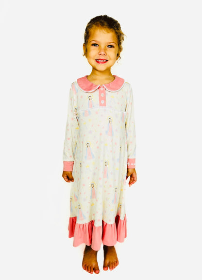 Girl wearing a Sweet Mary nightgown with pink accents on a white background